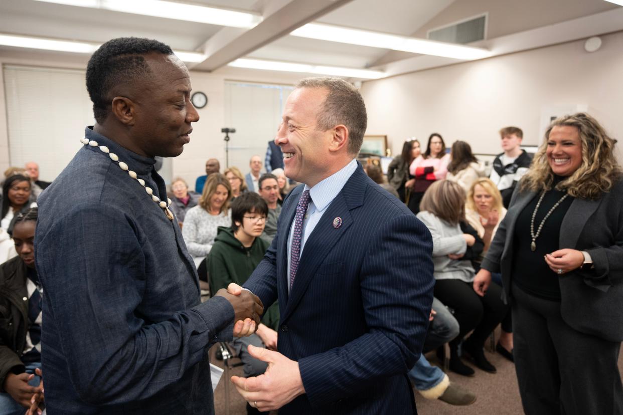 Mar 9, 2024; Haworth, NJ, USA; (Left) Omoyele Sowore greets Rep. Josh Gottheimer during a homecoming celebration for Sowore at Haworth Borough Hall. Omoyele Sowore, a Nigerian citizen, political activist, and journalist, who lives with his wife, son and daughter in Haworth, was detained by Nigerian authorities and imprisoned after he returned to his homeland.