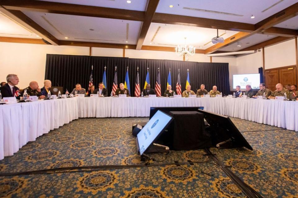 A general view shows US Secretary of Defence Lloyd Austin (back C) together with other ministers and NATO members attending an in-person Ukraine Defense Contact Group meeting at Ramstein Air Base, southwestern Germany, on April 21, 2023. (Photo by Andre Pain/AFP via Getty Images)