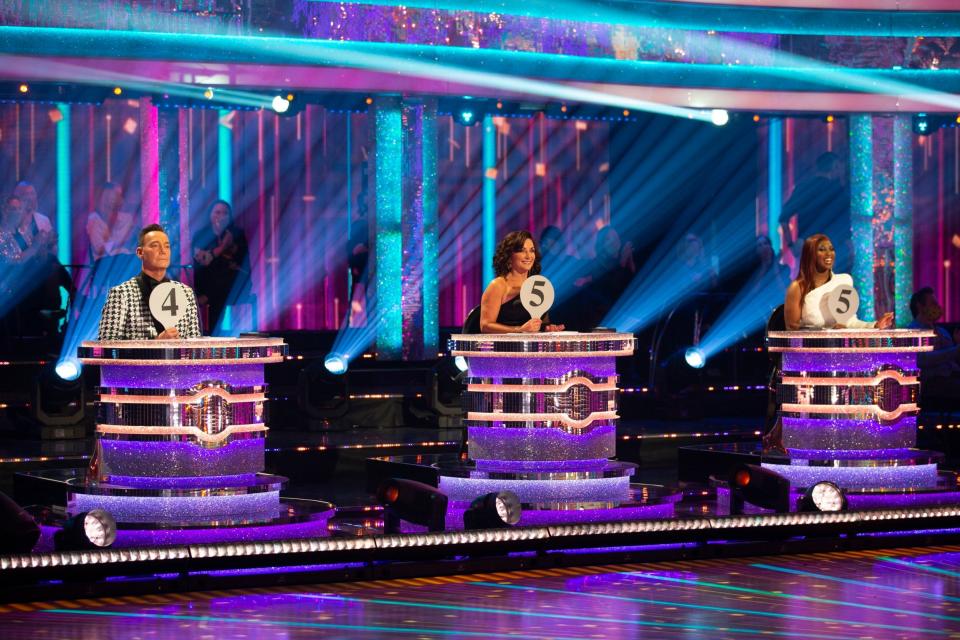 Judges Craig Revel Horwood, Shirley Ballas and Motsi Mabuse sat a distance from one another (PA)