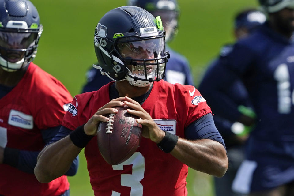 Seattle Seahawks quarterback Russell Wilson looks to pass during a practice drill at NFL football training camp, Wednesday, Aug. 12, 2020, in Renton, Wash. (AP Photo/Ted S. Warren, Pool)