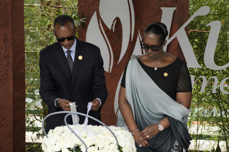 Rwandan President Paul Kagame, left and his wife, first lady Jeannette Kagame prepare to light a memorial flame, during a ceremony to mark the 30th anniversary of the Rwandan genocide, held at the Kigali Genocide Memorial, in Kigali, Rwanda, Sunday, April 7, 2024. Rwandans are commemorating 30 years since the genocide in which an estimated 800,000 people were killed by government-backed extremists, shattering this small east African country that continues to grapple with the horrific legacy of the massacres. (AP Photo/Brian Inganga)