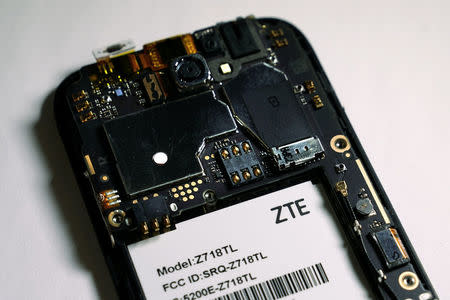 The inside of a ZTE smart phone is pictured in this illustration taken April 17, 2018. REUTERS/Carlo Allegri/Illustration