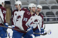 Colorado Avalanche left wing Andre Burakovsky (95) smiles as he skates back to the bench after scoring a goal against the San Jose Sharks during the second period of an NHL hockey game in San Jose, Calif., on Wednesday, May 5, 2021. (AP Photo/Tony Avelar)