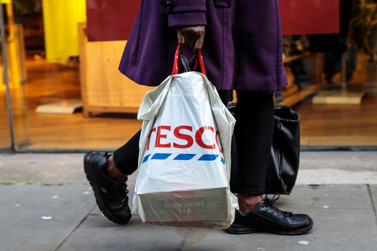 LONDON, ENGLAND - DECEMBER 27: A plastic Tesco bag is carried by a shopper on December 27, 2018 in London, England. England’s current 5-pence fee for plastic shopping bags could double in 2020, under plans announced by Environment Secretary Michael Gove. The levy would also apply to smaller retailers currently exempted from the law. (Photo by Jack Taylor/Getty Images)
