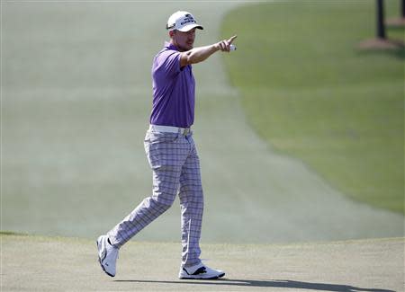 Sweden's Jonas Blixt reacts after his par putt on the seventh hole during the third round of the Masters golf tournament at the Augusta National Golf Club in Augusta, Georgia April 12, 2014. REUTERS/Jim Young