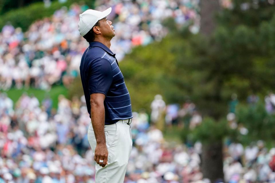 Tiger Woods reacts to his putt on the sixth green during the second round of the Masters.