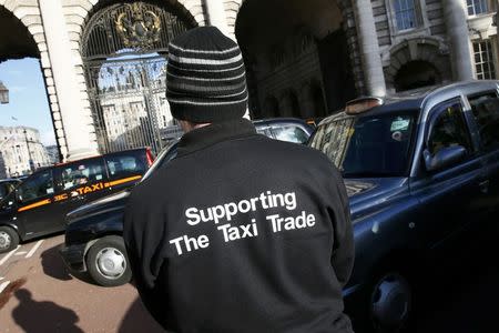 A London cab driver takes part in a protest by London cab drivers against Uber in central London, Britain February 10, 2016. REUTERS/Stefan Wermuth