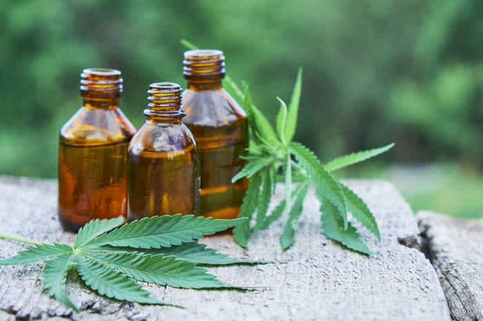 CBD products and marijuana leaves