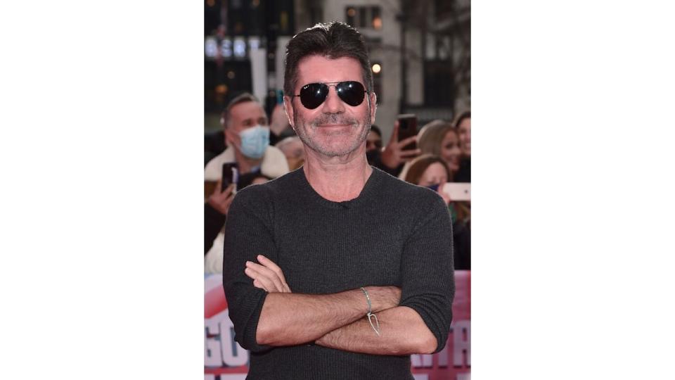 Simon Cowell in a grey jumper and sunglasses