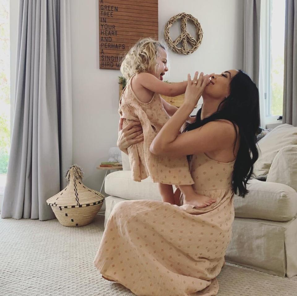 "The joys of having a daughter is that you can make them your mini," the expecting mama captioned this playful shot of her and Birdie in matching looks. 