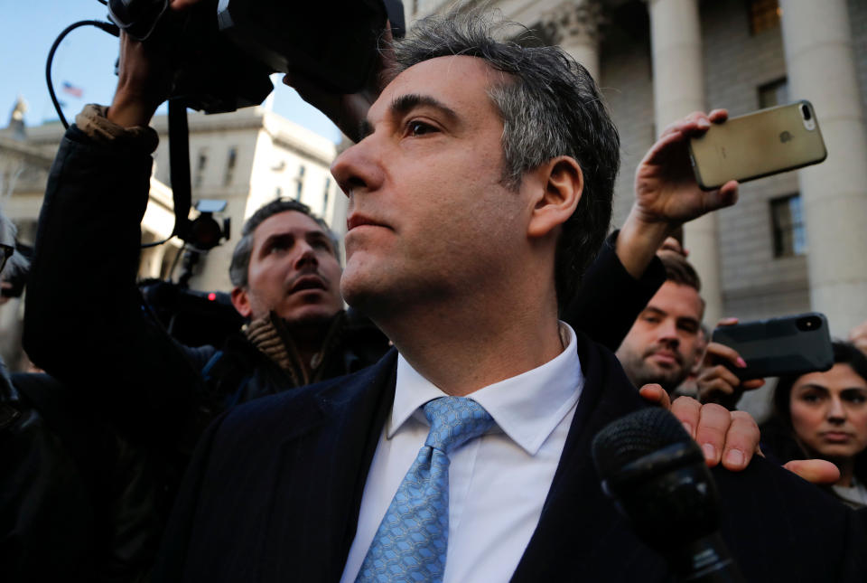 Michael Cohen walks out of federal court, in New York, after pleading guilty to lying to Congress about work he did on an aborted project to build a Trump Tower in Russia, on Nov. 29, 2018. | Julie Jacobson—AP/REX/Shutterstock