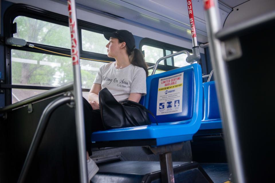 Lauren Smothers, owner of Light Trap Books, rides the Campbell route bus on her way to work on Thursday, May 11, 2023.