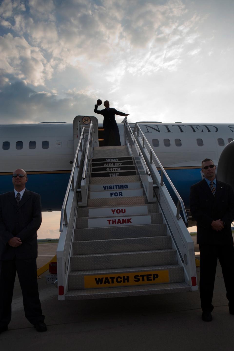 Vice President Joe Biden throws a football from the top of the stairs before boarding Air Force Two at Pittsburgh International Airport in Pittsburgh, PA, July 1,&nbsp;2009.