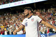 United States' Ricardo Pepi (16) celebrates with teammates after scoring his second goal against Jamaica during a FIFA World Cup qualifying soccer match, Thursday, Oct. 7, 2021, in Austin, Texas. (AP Photo/Eric Gay)