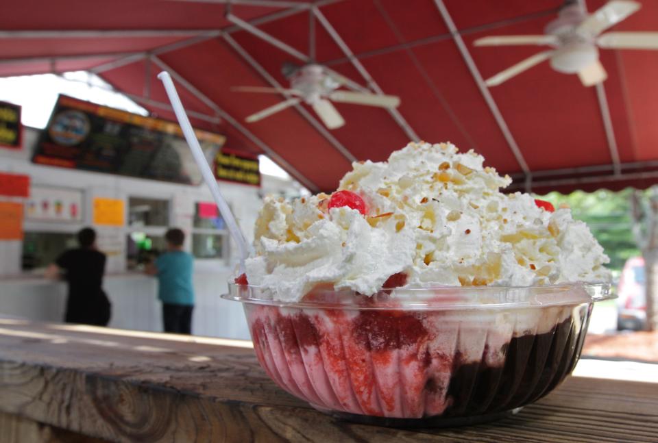 A Diamond Hill Sundae has four scoops of ice cream, four toppings, whipped cream, nuts and cherries at the Ice Cream Machine.