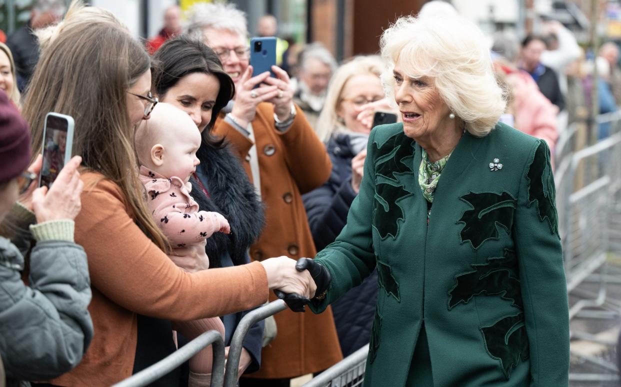 A small crowd gathers to see the Queen during her unexpected visit