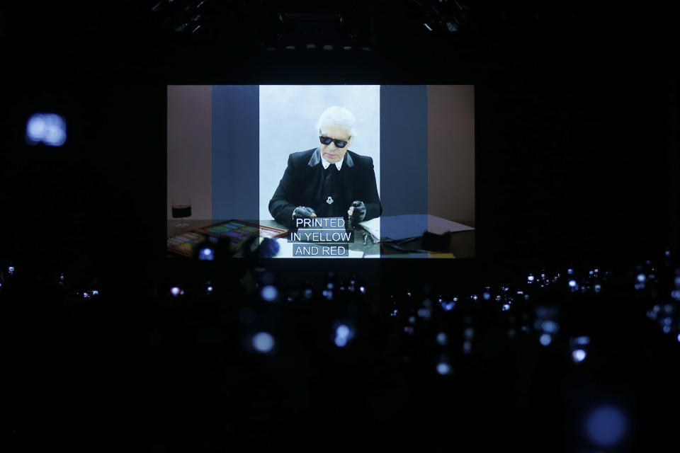 A video presentation showing the late designer Karl Lagerfeld and his association with Fendi is shown after the Fendi women's Fall-Winter 2019-2020 collection, that was presented in Milan, Italy, Thursday, Feb.21, 2019. (AP Photo/Antonio Calanni)