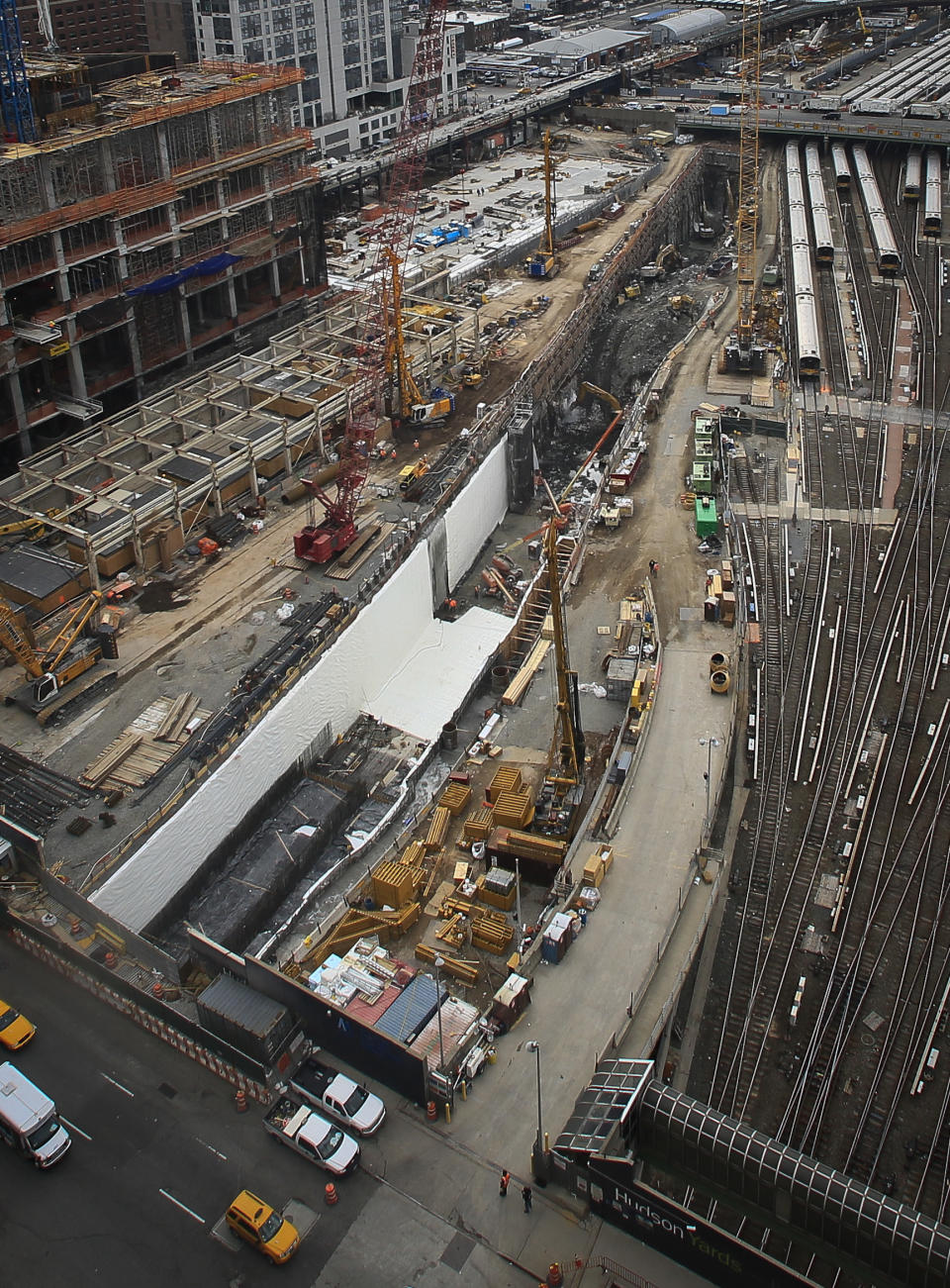 This photo made Thursday April 17, 2014, shows ongoing construction of a rail tunnel, center, at the Hudson Yards redevelopment site on Manhattan's west side in New York. Amtrak is constructing an 800-foot-long concrete box inside the project to preserve space for a tunnel from Newark to New York City that would allow it to double rail capacity across the Hudson River. (AP Photo/Bebeto Matthews)