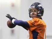 Denver Broncos quarterback Peyton Manning readies to throw a pass during their practice session for the Super Bowl at the New York Jets Training Center in Florham Park, New Jersey January 30, 2014. REUTERS/Ray Stubblebine