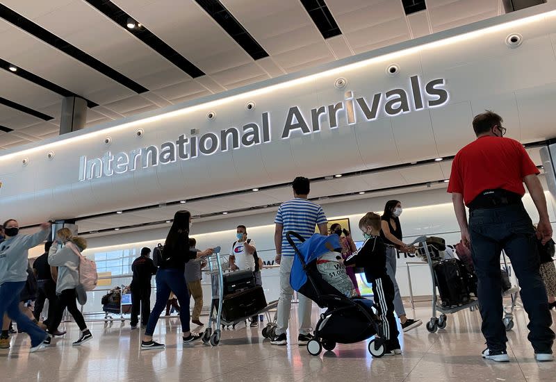 Passengers from international flights arrive at Heathrow Airport, following the outbreak of the coronavirus disease (COVID-19), London, Britain