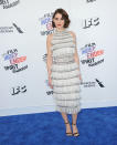 <p>In a look far from her <em>Glow</em> character, Brie looked more Trudie Campbell on the red carpet in a white fringed gown. (Photo: Getty Images) </p>