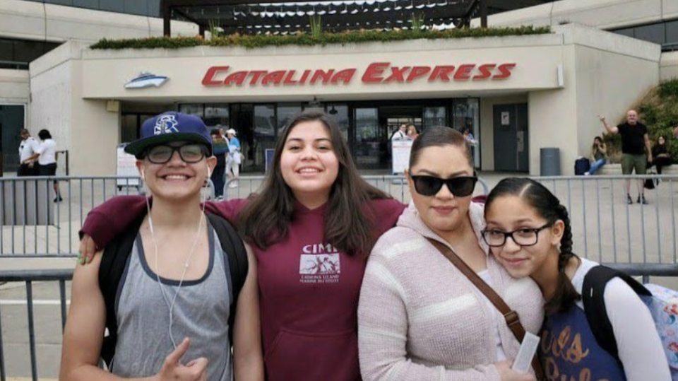 Mrs Reyes is seen with her three children.