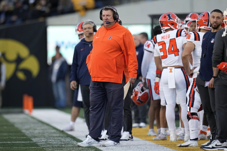 Illinois head coach Bret Bielema watches from the sideline during the first half of an NCAA college football game against Iowa, Saturday, Nov. 18, 2023, in Iowa City, Iowa. (AP Photo/Charlie Neibergall)