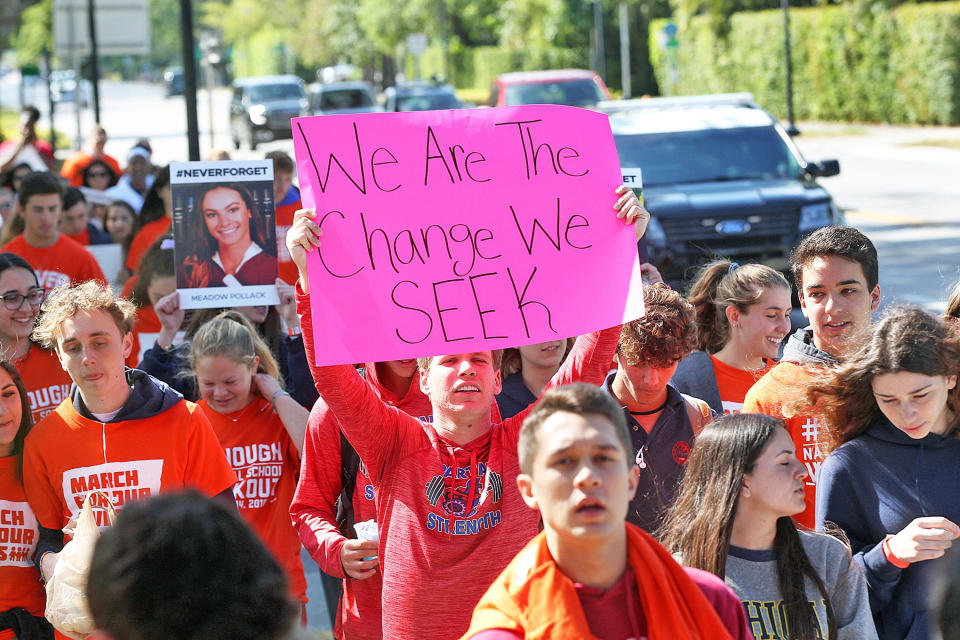 <p>Students take part in a national walkout to protest gun violence at Marjory Stone Douglas High School on March 14, 2018 in Parkland, Fla.<br> (Photo: Getty Images) </p>