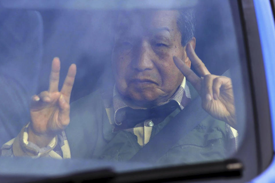 Iwao Hakamada flashes v-signs on his way back from a walk in Hamamatsu, Shizuoka prefecture, central Japan Monday, March 13, 2023. Tokyo’s high court on Monday ordered a retrial for Hakamada, 87-year-old former boxer who has been on death row for nearly six decades after his murder conviction that his lawyers said was based on forced confession and fabricated evidence. (Kyodo News via AP)