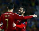 Spain's Alvaro Morata (L) is congratulated by Isco after scoring against Ukraine during their Euro 2016 qualifier soccer match at Ramon Sanchez Pizjuan stadium in Seville, March 27, 2015. REUTERS/Marcelo del Pozo