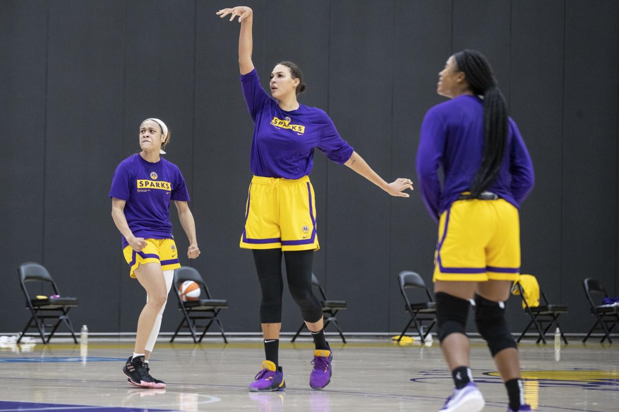 Center Liz Cambage follows through on a shot during a Sparks practice.