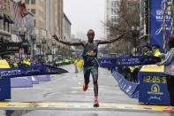 Evans Chebet of Kenya breaks the tape to win the 127th Boston Marathon, Monday, April 17, 2023, in Boston. (AP Photo/Winslow Townson)