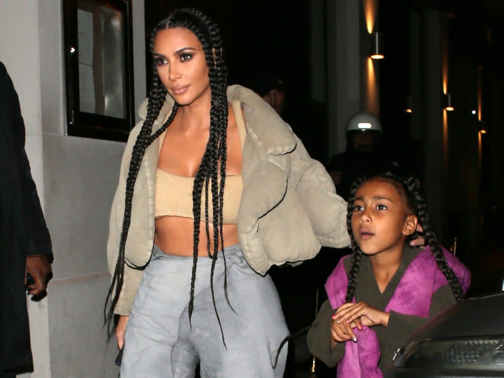 North West and Kim Kardashian (L) (Beretta/Sims/Shutterstock)