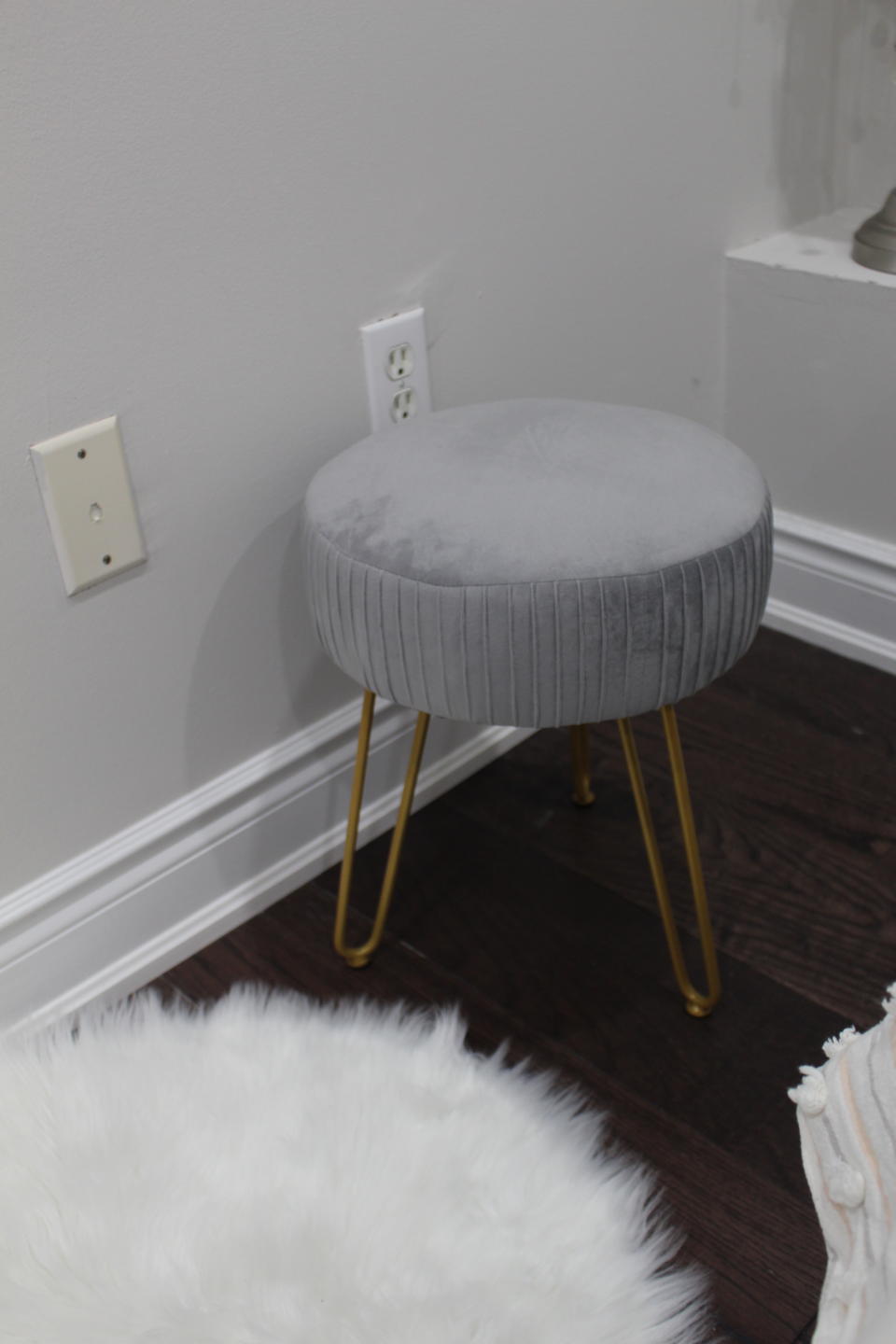 I love that this velvet stool adds a statement to my room (plus it's really comfy!). (Photo via Farah Khan)