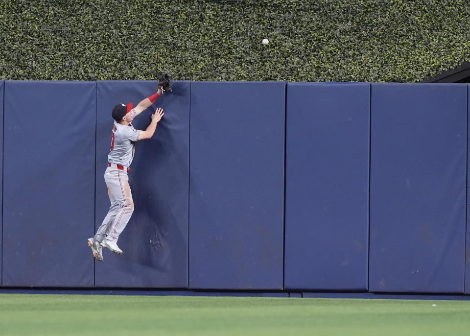 Washington Nationals outfielder Jacob Young (30) watches a home run by Miami Marlins' Otto Lopez go over the fence during the ninth inning of a baseball game, Saturday, April 27, 2024, in Miami. (AP Photo/Marta Lavandier)