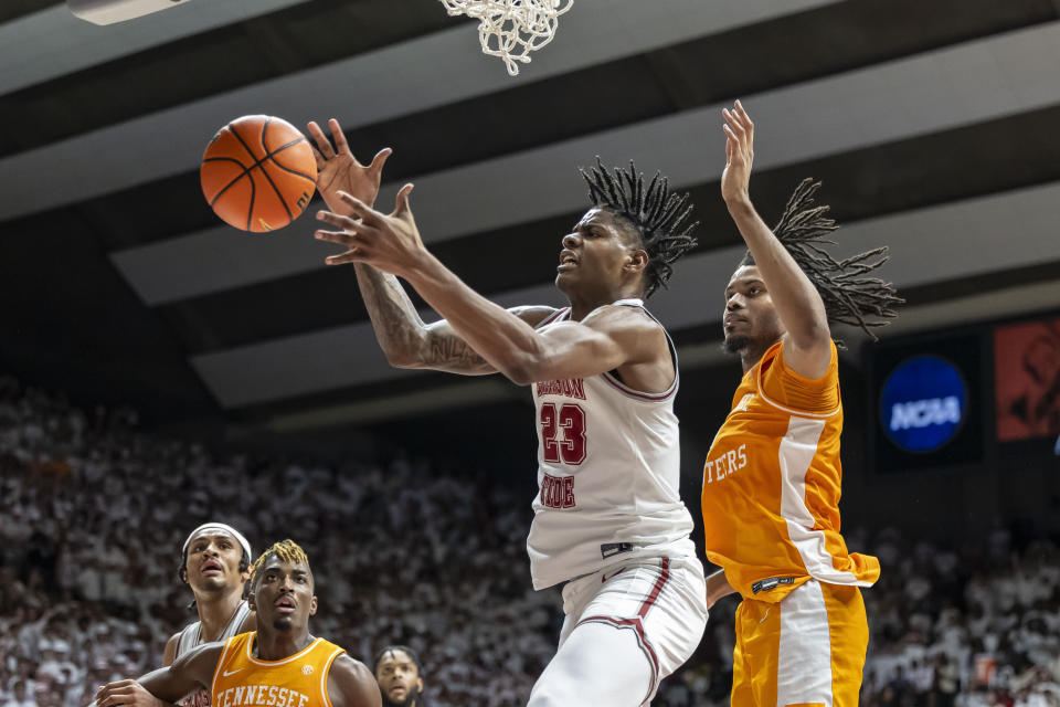 Alabama forward Nick Pringle (23) chases a rebound with Tennessee forward Jonas Aidoo, right, defending during the second half of an NCAA college basketball game, Saturday, March 2, 2024, in Tuscaloosa, Ala. (AP Photo/Vasha Hunt)