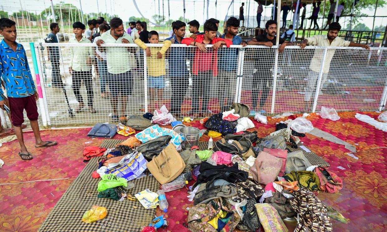 <span>The personal belongings of people who died in the crush in Hathras, India.</span><span>Photograph: Ritesh Shukla/Getty Images</span>