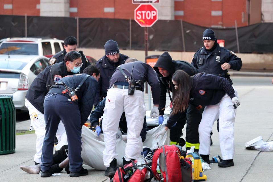 The body armor would be worn by on duty EMS workers like the men and women pictured here assisting a man found in cardiac arrest on a New York City sidewalk. William Farrington