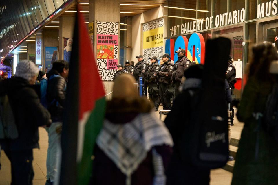 Police stand guard outside the Art Galley of Ontario, in Toronto, Ontario, March 2, 2024 as protesters confront attendees of a reception for Canadian Prime Minister Justin Trudeau and Italian Prime Minister Giorgia Meloni which was cancelled following the protests. (Photo by Geoff Robins / AFP) (Photo by GEOFF ROBINS/AFP via Getty Images)