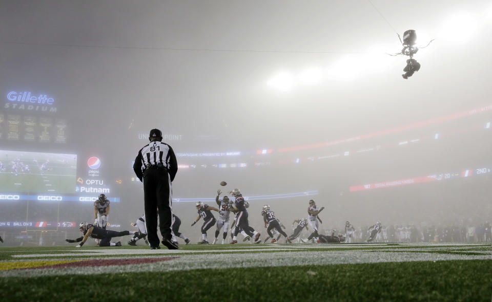 <p>New England Patriots quarterback Tom Brady, center, passes in the fog against the Atlanta Falcons during the second half of an NFL football game, Sunday, Oct. 22, 2017, in Foxborough, Mass. (AP Photo/Charles Krupa) </p>