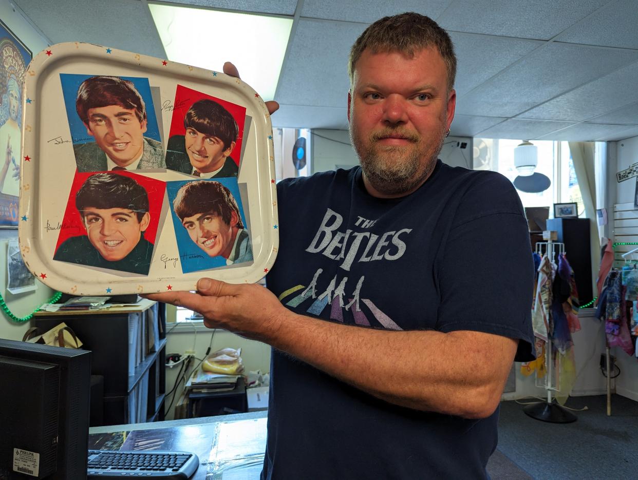 Roger Wieczorek has an original Beatles TV tray from the 1960s among the collectibles in his Hat Trick Records shop in Clyde.