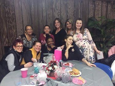 Courtney English (right) celebrates at her baby shower with friends and Lamp Post Diner co-workers. The waitress was pleasantly surprised by a $100 tip from a Voorhees police officer left with a message to enjoy her first baby.