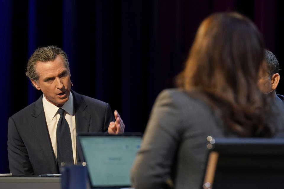 Democratic Gov. Gavin Newsom responds to a question from co-moderator Marisa Lagos, right, during the gubernatorial debate between Newsom and Republican challenger state Sen. Brian Dahle, held by KQED Public Television in San Francisco, on Sunday, Oct. 23, 2022. (AP Photo/Rich Pedroncelli, Pool)
