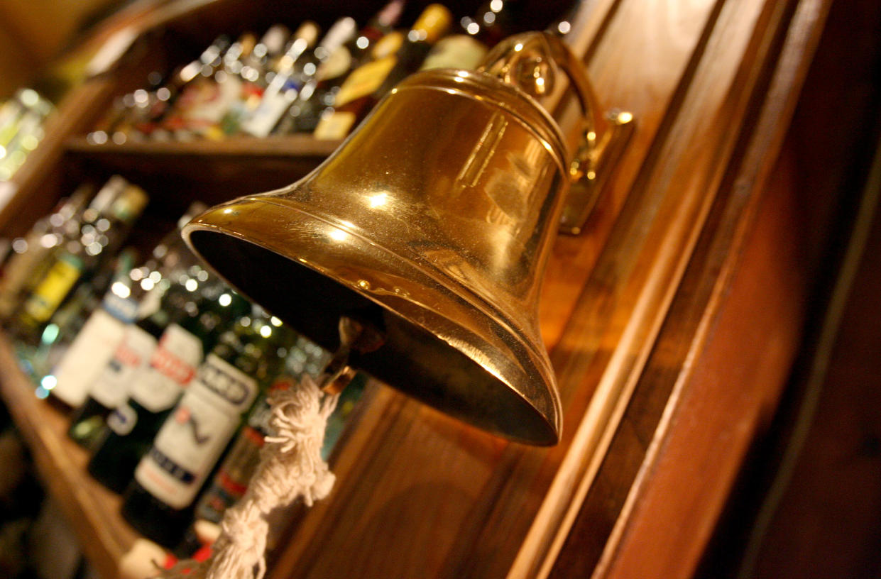 A traditional "last orders" bell is seen behind the bar at The Speaker pub in Victoria, central London, November 23, 2005. About one third of all the pubs, clubs and shops in England and Wales licensed to sell alcohol will stay open for longer from midnight on Wednesday as Britain seeks a new way to tackle its binge drinking problem. Under new licensing laws, the country's pubs and bars will be allowed to stay open for longer and the fixed 11 p.m. closing time observed by most pubs since World War One will be swept away. CPROD REUTERS/Toby Melville