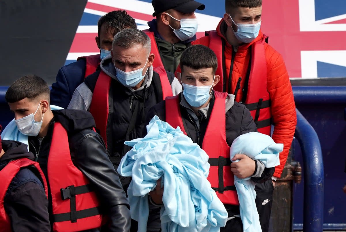 A group of people thought to be migrants are brought in to Dover, Kent, from a Border Force vessel following a small boat incident in the Channel. Picture date: Friday September 2, 2022 (Gareth Fuller/PA) (PA Wire)