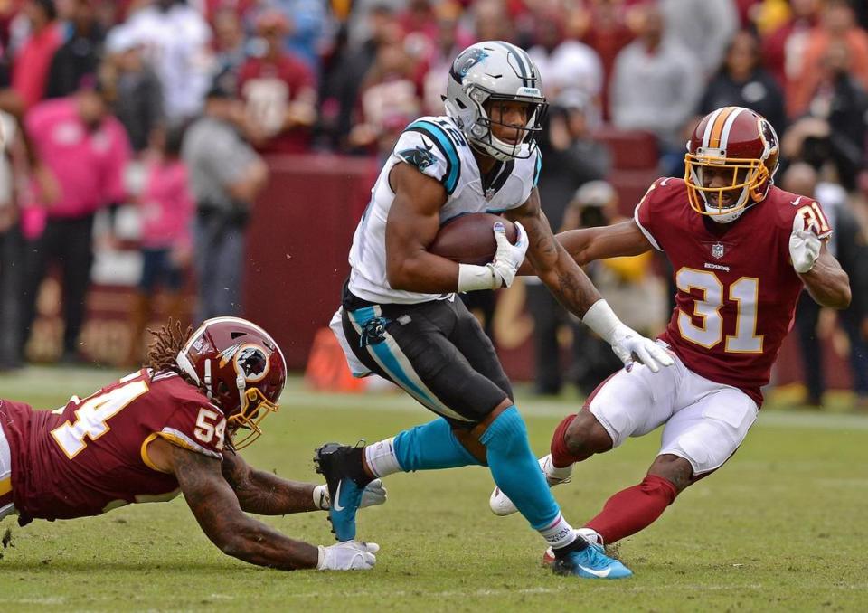 Carolina Panthers wide receiver DJ Moore, center, breaks out between two Washington defenders during his rookie year in 2018. Moore had three consecutive 1,000-yard receiving seasons as a Panther, but was traded to Chicago in 2023 as part of the deal that brought the Panthers No. 1 draft pick Bryce Young.