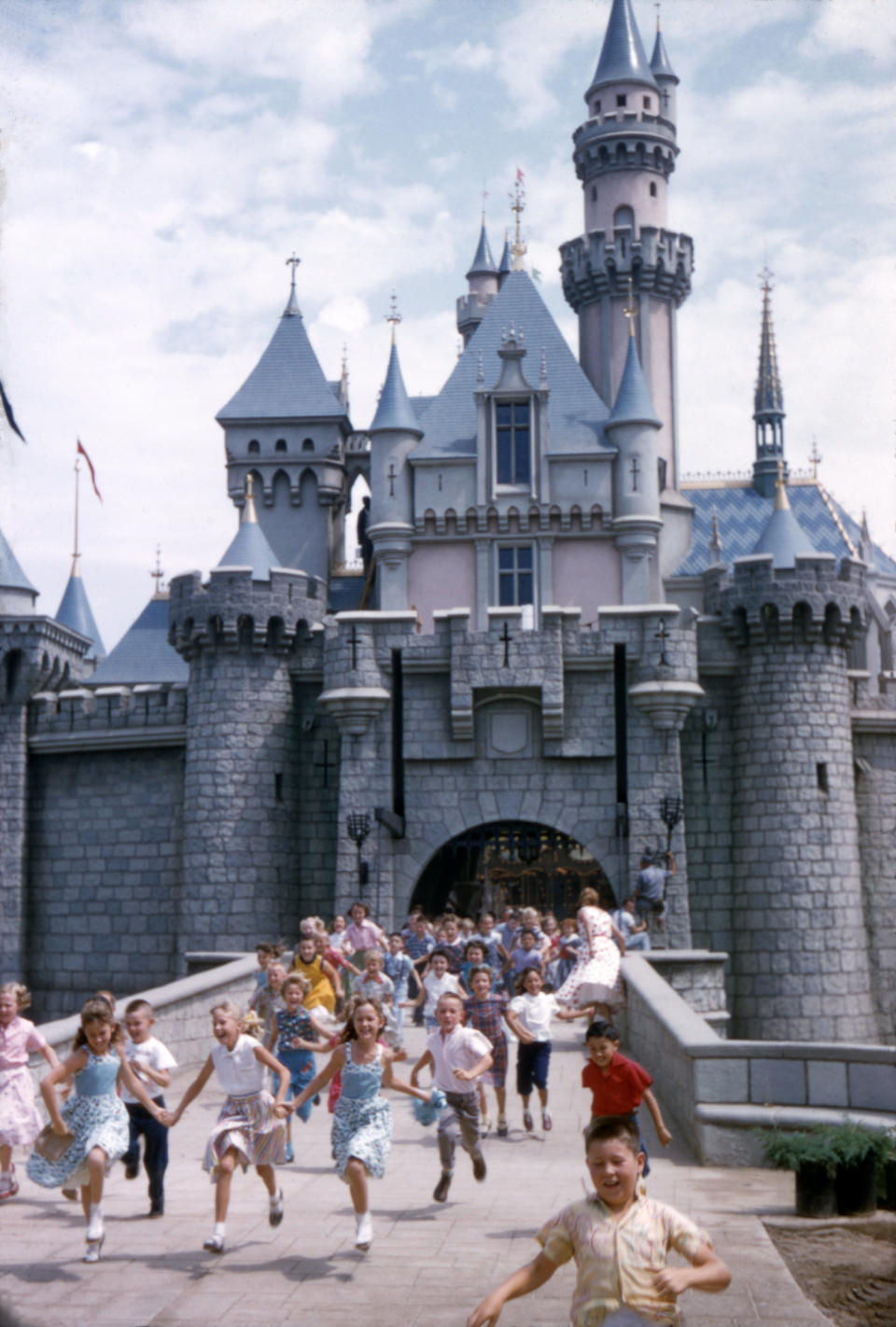 Kids cavort outside Sleeping Beauty Castle in 1955.