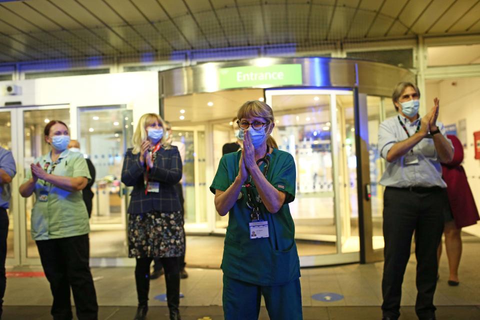 <p>NHS staff outside the Chelsea and Westminster Hospital in London</p> (PA)