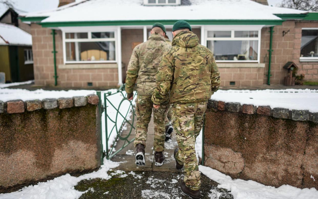 Marines from 45 Commando are seen conducting welfare checks on December 2, 2021 in Lumphanan, Scotland - Peter Summers/Getty