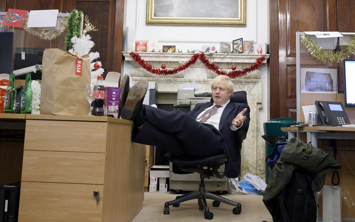 Boris Johnson puts his feet up in a photograph taken at 10 Downing Street on December 23 2020 - Andrew Parsons/No10 Downing St